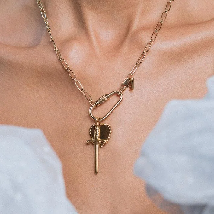 Shop Classic Women's  Necklaces & Pendants with a Modern Twist-TORMENT. Heart & Dagger Carabiner Charm Necklace - Gold