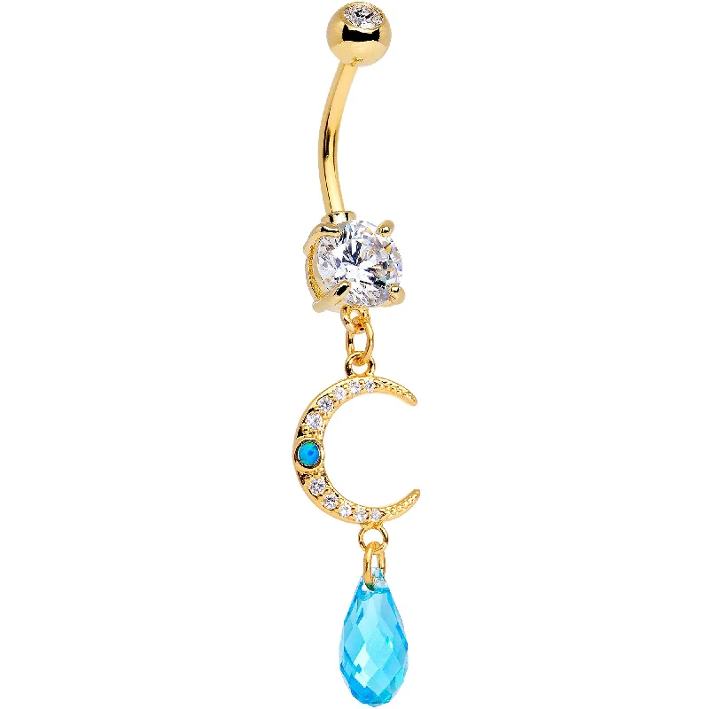 Trendy Belly Rings for Fashion-Loving Women -Handcrafted Clear Blue Gem Gold Tone Crescent Moon Dangle Belly Ring Trendy Belly Rings for Fashion-Loving Women -Handcrafted Clear Blue Gem Gold Tone Crescent Moon Dangle Belly Ring