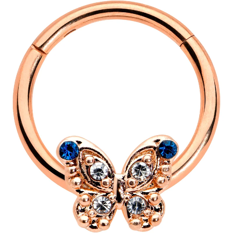 Affordable and Stylish Nose Rings -16 Gauge 3/8 Blue Gem Rose Gold Tone Butterfly Hinged Segment Ring Affordable and Stylish Nose Rings -16 Gauge 3/8 Blue Gem Rose Gold Tone Butterfly Hinged Segment Ring